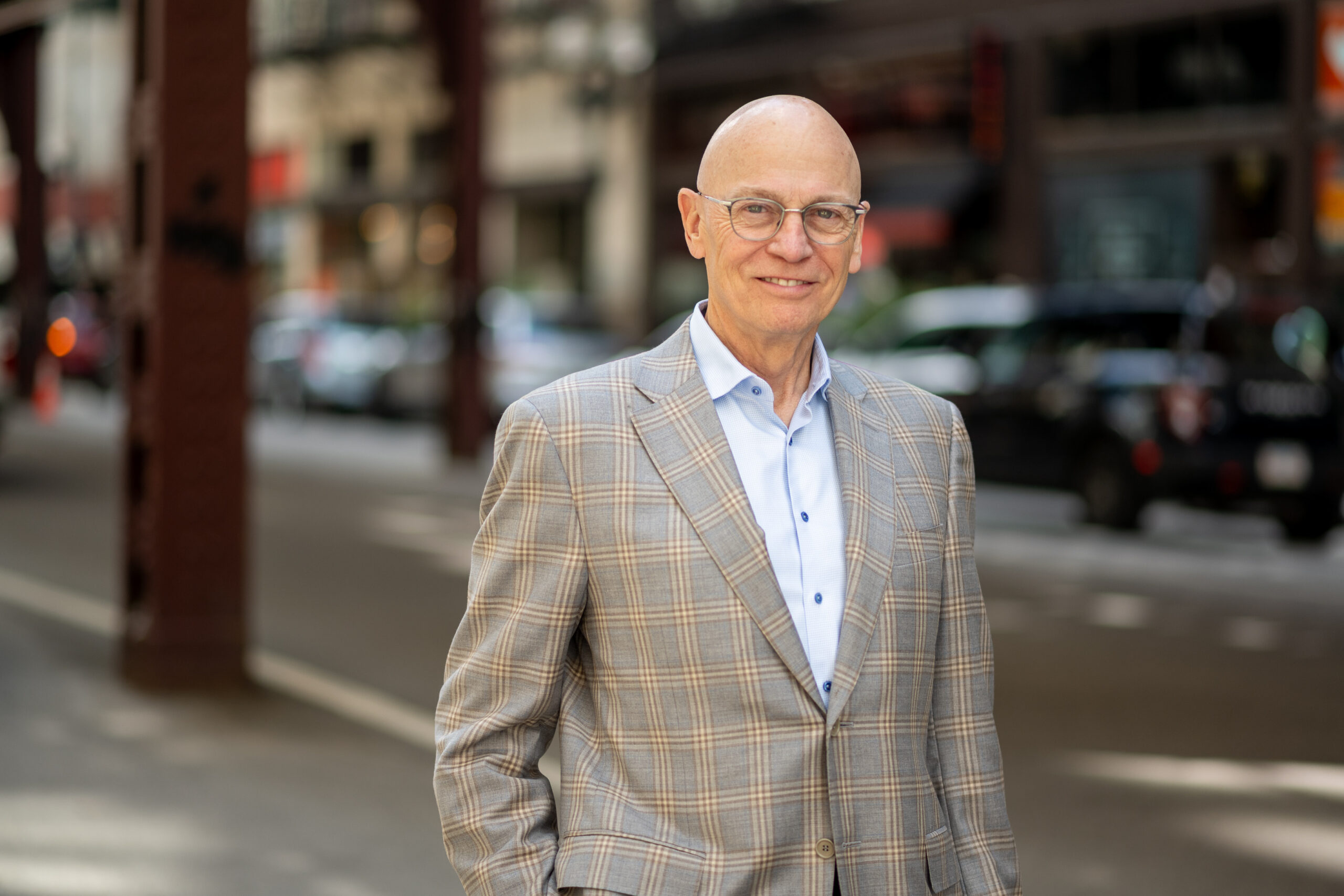 Professional portrait of the physician outdoors in a city setting